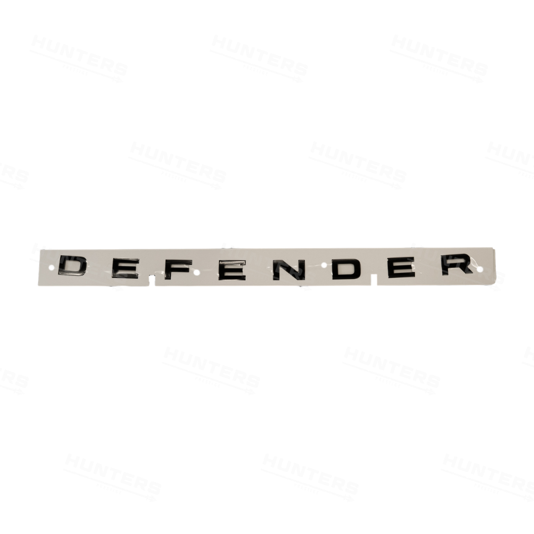 Genuine gloss black Defender lettering supplied on application backing