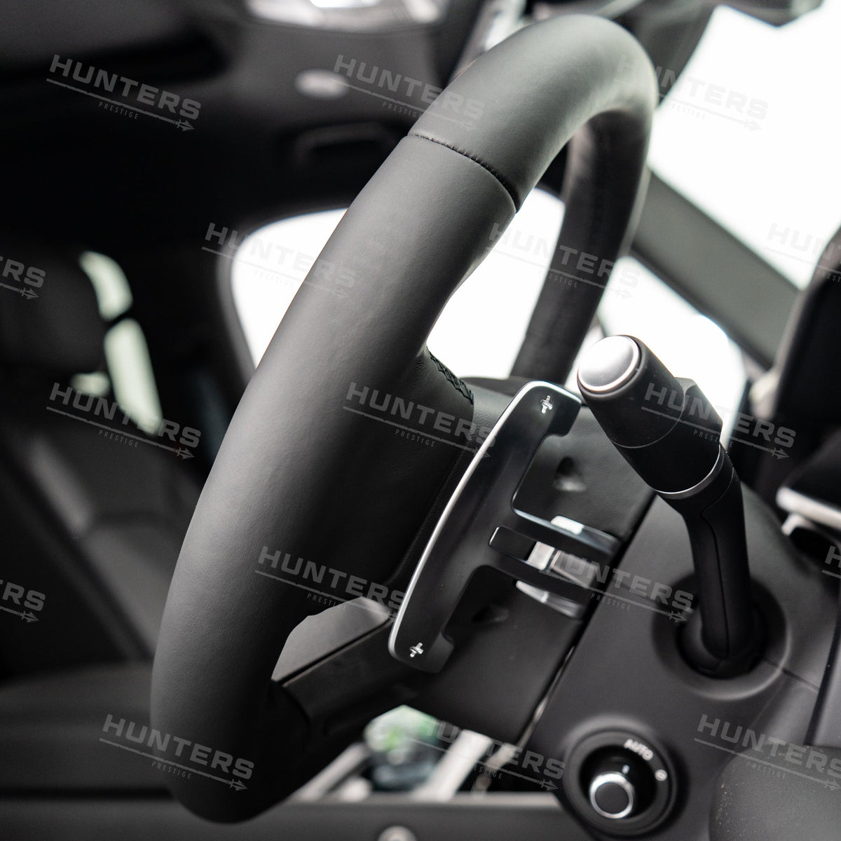 V8-style paddle shifter shown fitted behind a Defender steering wheel