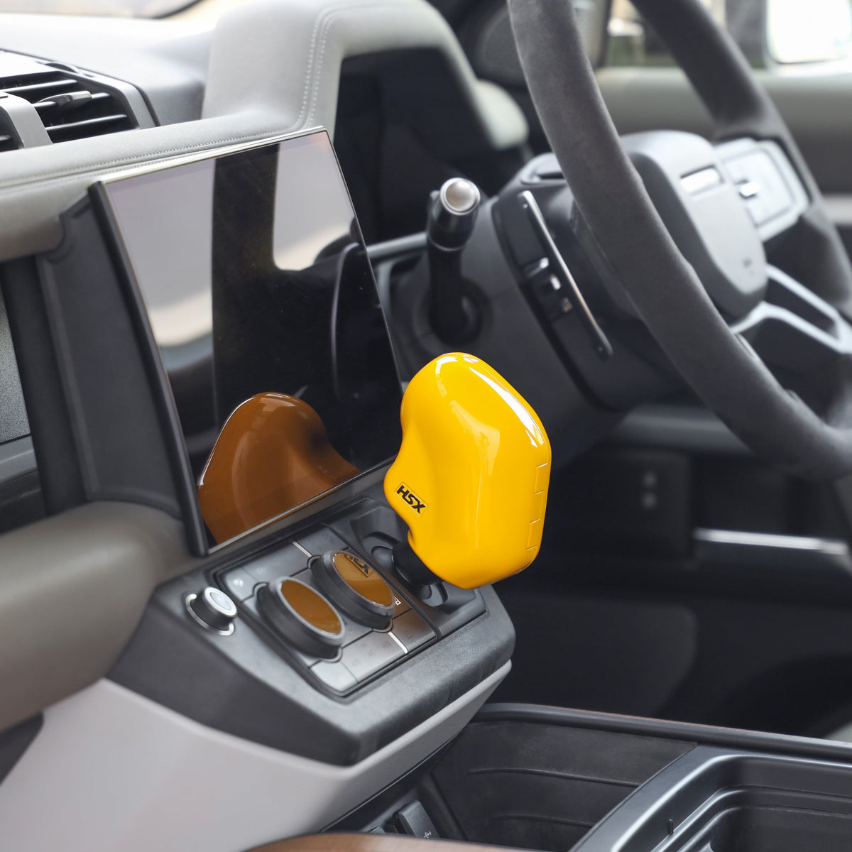 HSX yellow gear lock fitted to a Defender L663 gear selector